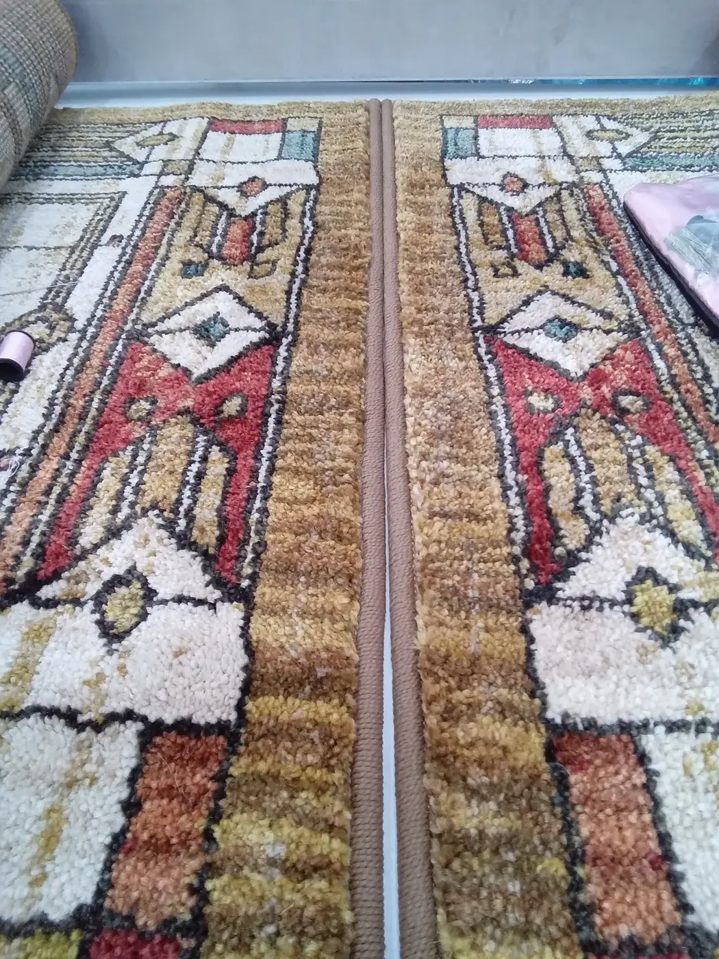 Close-up of clean rug pile with crisp pattern and color